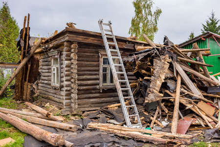 Disassembling an old wooden frameの写真素材