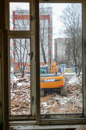 Russia - November 2016: Demolition of dilapidated housing, view from the window of a neighboring...