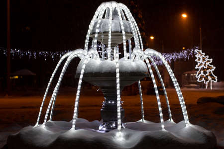 Luminous fountain in the winter for the new year in the parkの写真素材