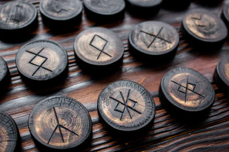 Set of anglo-saxon runes carved in wood - anglo-saxon futhark (futhorc)の写真素材