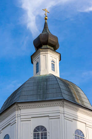 The upper part of the old Russian Orthodox church with a dome and an Orthodox cross. Belkino, Russiaの写真素材