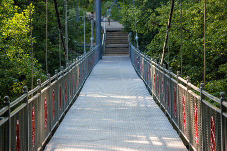 Metal pedestrian bridge over the Repinka River in Obninsk, Russia