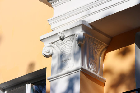 A simple capital on a column on the facade of the building. 1950s Stalin's Empire Architecture