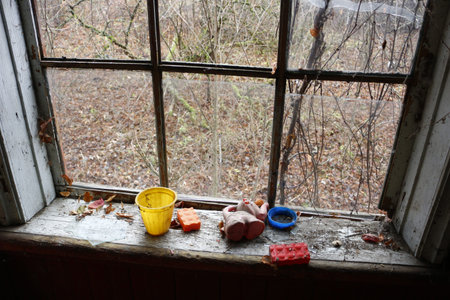 Abandoned children toys in an abandoned old houseの写真素材