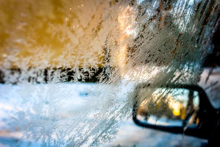 February frosty patterns on the windows of the car. Iced Glassの写真素材