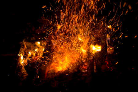 Beautiful bonfire with sparks flying upwards, view from aboveの写真素材