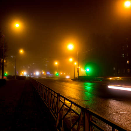 City road in the evening during a thick fog, foggy eveningの写真素材