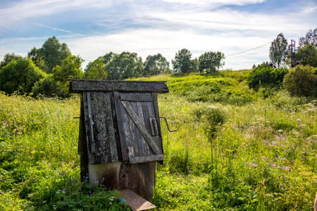 Old village well, rural landscape in summerの写真素材