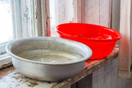 The Water tanks on the windowsill indoorsの写真素材