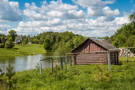 Rural landscape. Pond and an old cellar, Lyubitsy Village, Kaluzhskiy region, Russiaの写真素材