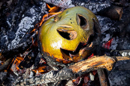 Jack-o'-lantern from pumpkin in the bonfire after Halloweenの写真素材