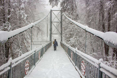 Snow-covered pedestrian bridge in winter. Obninsk, Russiaの写真素材