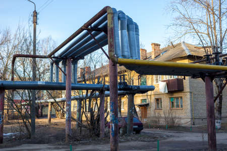 Maloyaroslavets, Russia - April 2018: Outskirts of the town of Maloyaroslavets, heating pipes in the foregroundのeditorial素材