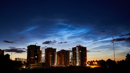 Noctilucent clouds (night shining clouds) in the night sky over the city. July 2020 - Obninsk,...