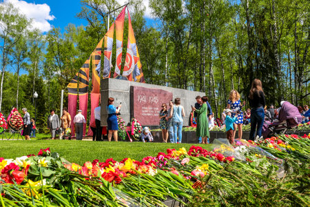 Obninsk, Russia - May 9, 2016: Celebration of the Victory Day, Great Patriotic War 1941-1945. Laying flowers at the memorial "Eternal Flame"のeditorial素材
