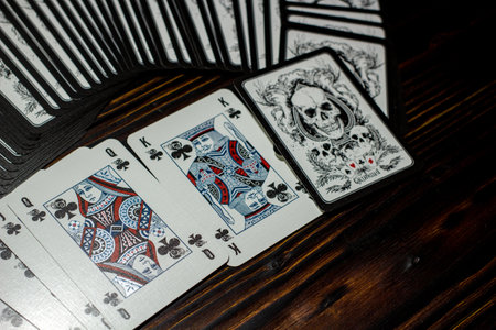 Russia - February 2019: Playing cards "Grimaud" with skulls on the vintage tableのeditorial素材
