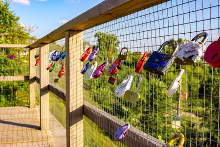 Ermolino, Russia - August 2018: A bunch of wedding locks on the fence of the observation platform in Rusinovo. Kaluzhskiy region, Borovskiy district, Ermolinoのeditorial素材