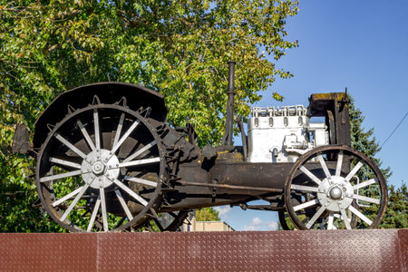 Vysokinichi, Russia - August 2018: Monument to the first tractor HTZ (Kharkov tractor plant) in the village of Vysokinichi, Russia. Kaluzhskiy region, Zhukovskiy districtのeditorial素材