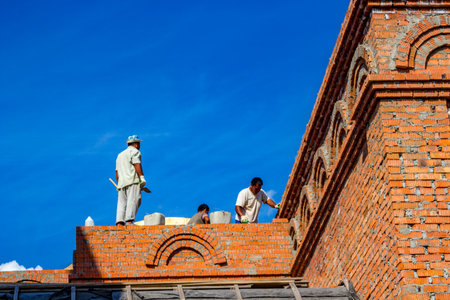 Ilinskoe, Russia - August 2018: Migrant workers build a building in the village of Ilinskoe (Iljinskoe). Zhukovsky district, Kaluzhskiy regionのeditorial素材