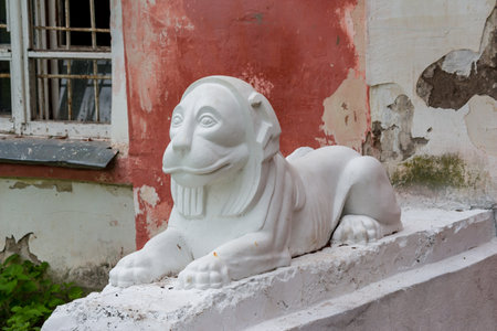 Avchurino, Russia - July 2019: Sculptures of lions near the building at the entrance. The 19th century neo-Gothic library in the Avchurino estate near Kaluga. Ferzikovsky districtのeditorial素材