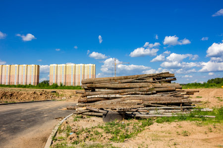 Folded logs on the roadside, building a new district