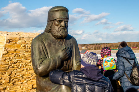 Kaluga region, Russia - March 2019: Monument to the Russian Orthodox monk Seraphim of Sarov. Ethnographic Park Ethnomirのeditorial素材