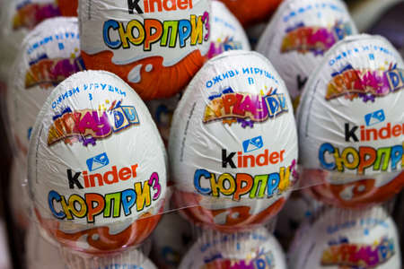 Russia - February 2021: Kinder surprise chocolate eggs on the window of a grocery store - editoral