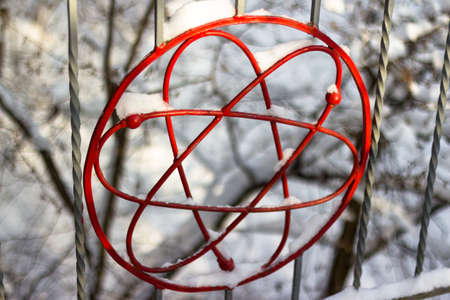 The image of the atom symbol on the railing of the footbridge. Obninsk city, Russiaの写真素材