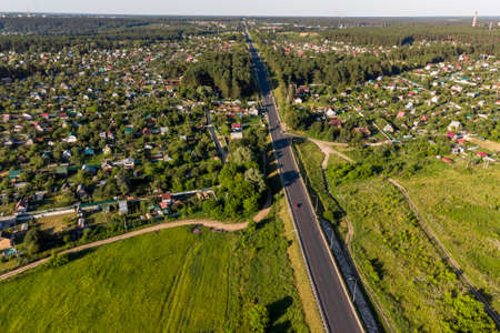 Aerial view of a highway passing through the countryside. Varshavskoye highway near the village of Obolenskoe, Kaluzhskiy region, Russiaの写真素材
