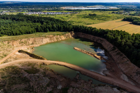 Top view of a man with a bicycle in the middle of a sandy landscapeの写真素材