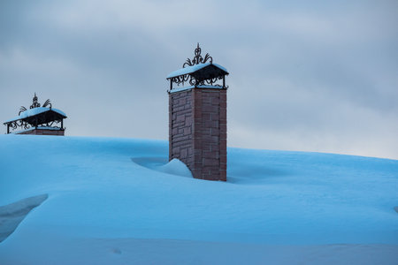 Old footbridge over a running stream with holes in the deckの写真素材