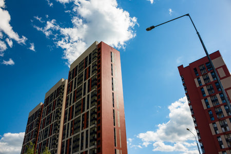Construction of a modern residential area on the outskirts of the city, new buildings and tower cranes: Russia - May 2021のeditorial素材