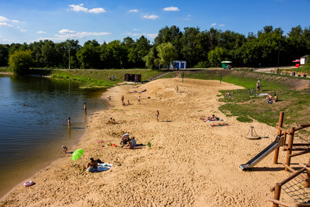View of the pond with people floating in Stradalovka pond in Balabanovo city, Russia - August 2022のeditorial素材