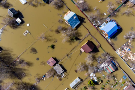 Aerial view of the flooded suburban areas during the spring flood. Houses in the water during the floodの写真素材