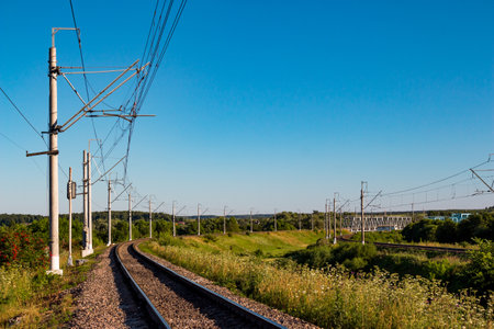 Scenic view of railway tracks turning right in the countrysideの写真素材
