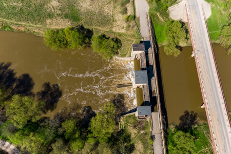 View from a high altitude of a dam on the river and a road bridge, a hydraulic structureの写真素材
