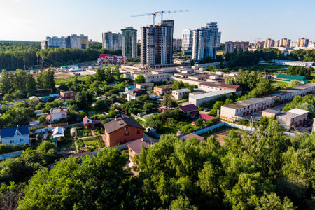 Aerial view of a private sector on the outskirts of a rapidly growing city: Russia - July 2022のeditorial素材