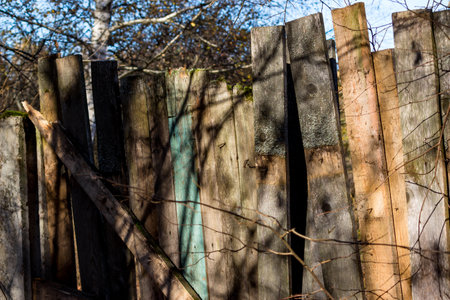 Old rickety wooden fence in the countrysideの写真素材