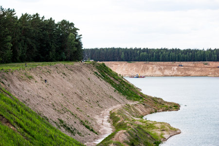 Reclaimed slope of a flooded sand pit. Bolotsky quarry, Kaluzhskiy region, Russiaの写真素材