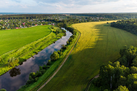 Beautiful landscape in the countryside from the air, farm fields in the river valley
