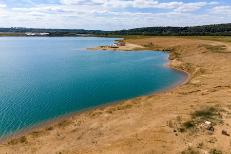 Pond on a flooded sand pit, landscape from aboveの写真素材