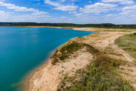 Pond on a flooded sand pit, landscape from aboveの写真素材