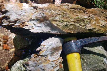 Dense limestone with chalcedony veins split by pickaxe, geological tourismの写真素材