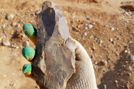 Stone similar to a large flint ax used in the Stone Age, field photo at a quarryの写真素材