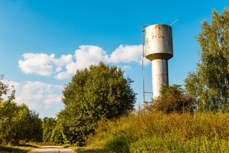 Large metal water tower in the countrysideの写真素材