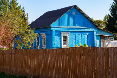 Old village house in traditional style painted blue. Kaluga region, Russiaの写真素材