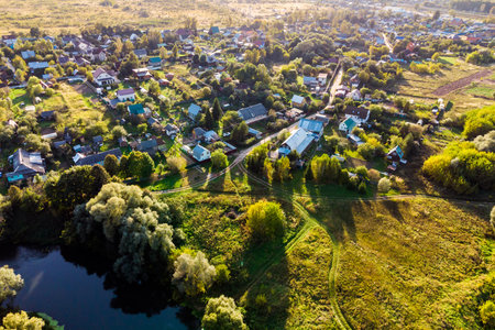 Small village from the air, rural settlement by the riverの写真素材