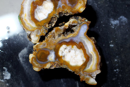 White-orange agate after cutting in a stone-cutting workshop