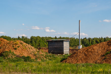 A shed in a field connected to the power grid and wireless internet