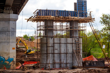 Bridge pier under construction with scaffolding and formwork for expansion project in progress: Russia - May 10, 2025のeditorial素材